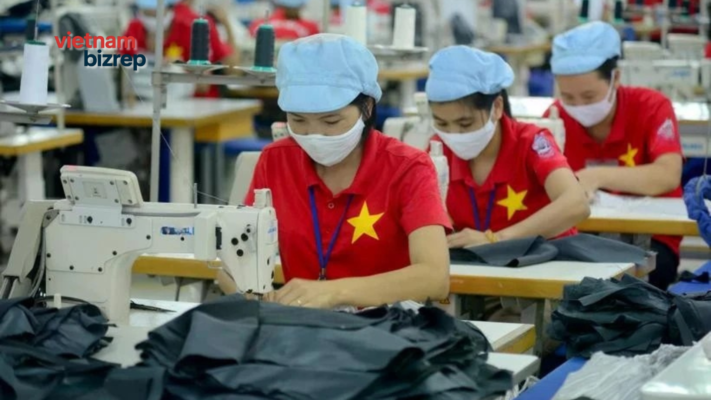 A panoramic view of a modern and clean garment factory in Vietnam with skilled workers on the job.